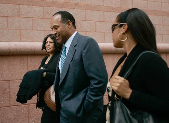 O.J. Simpson arrives at the Clark County Regional Justice Center with his sister Carmelita Duri ...