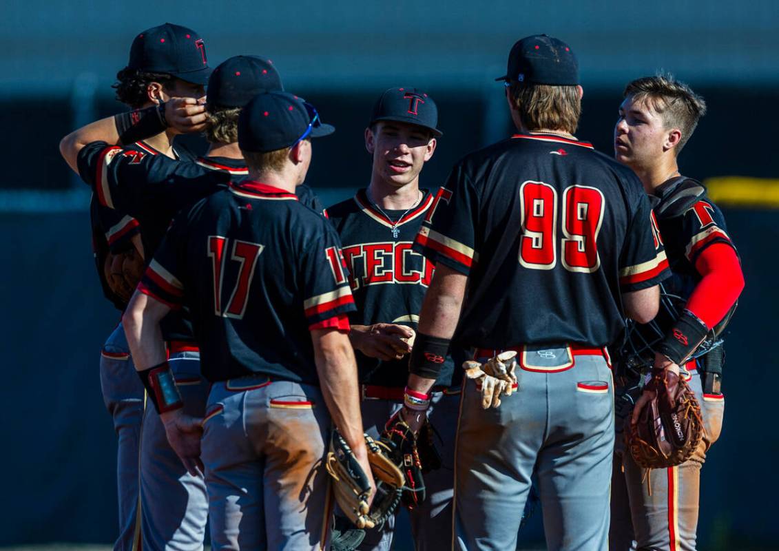 Tech pitcher Tiernon Wolf chats with teammates on the mound as Cheyenne has bases loaded during ...