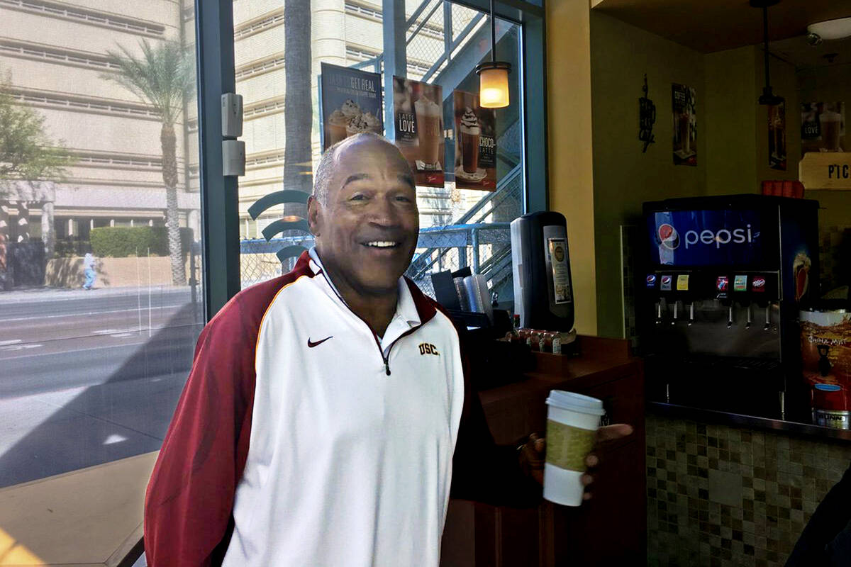 O.J. Simpson is seen after breakfast with his lawyer at a cafe across the street from the Clark ...