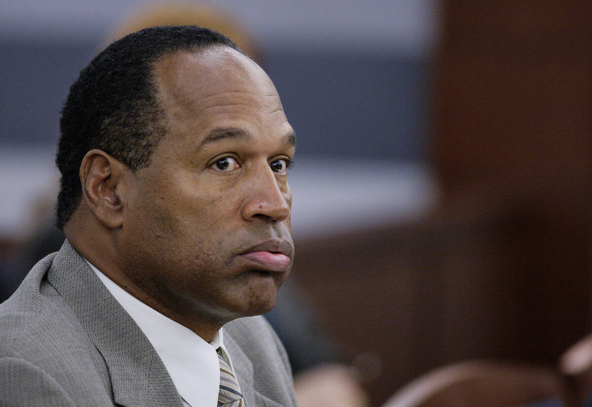 Former NFL great O.J. Simpson listens in court at the Clark County Regional Justice Center in L ...