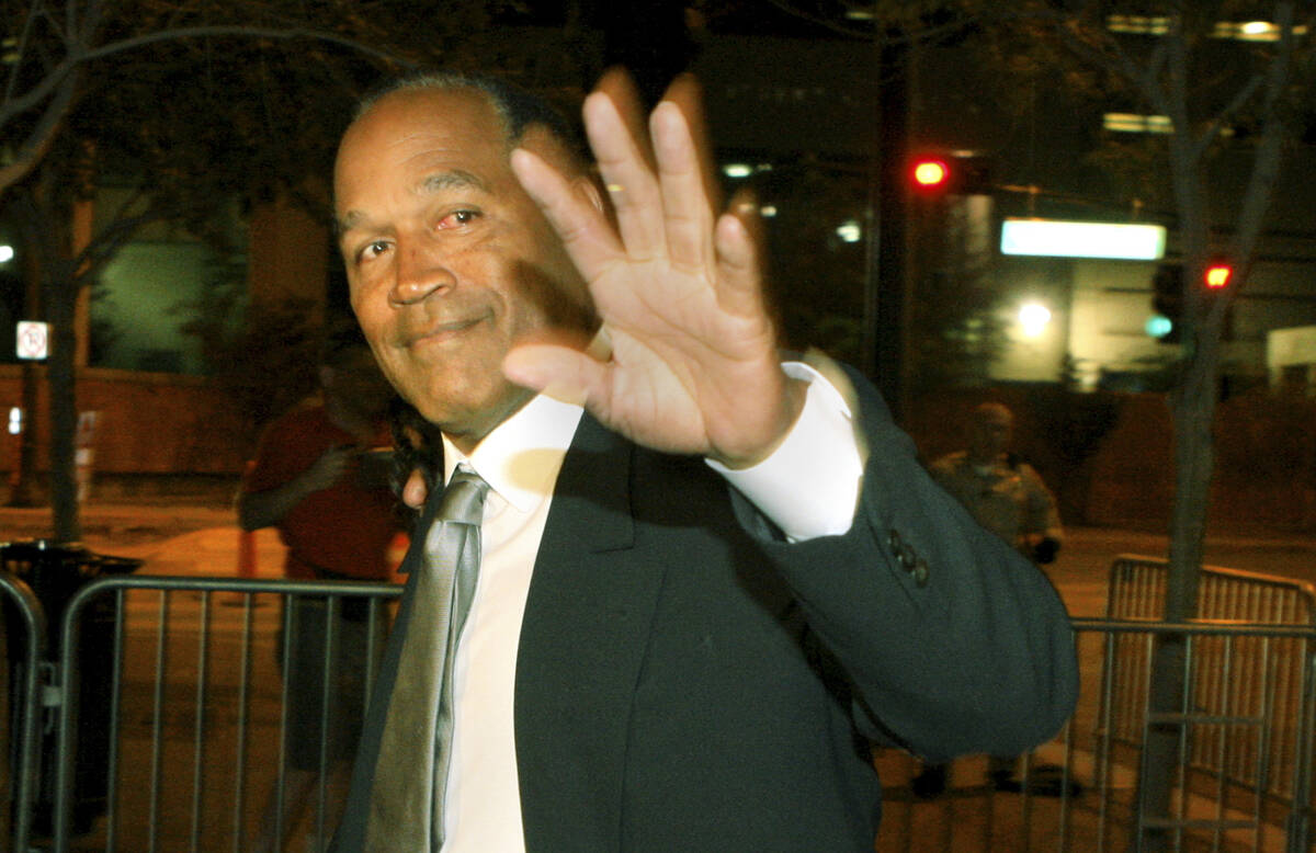 O.J. Simpson arrives at the Regional Justice Center Friday, Oct. 3, 2008, for the verdict in hi ...