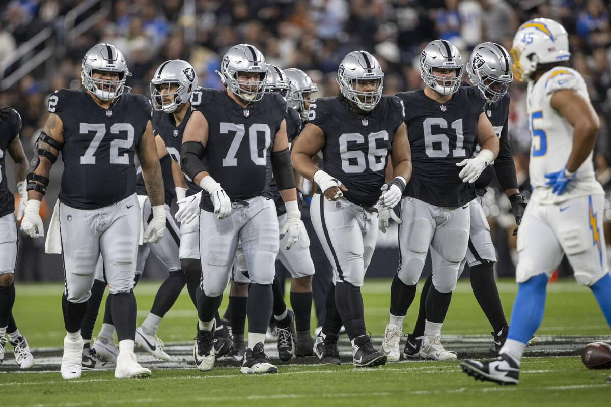 Raiders offensive linemen, from left, Jermaine Eluemunor (72), Greg Van Roten (70), Dylan Parha ...