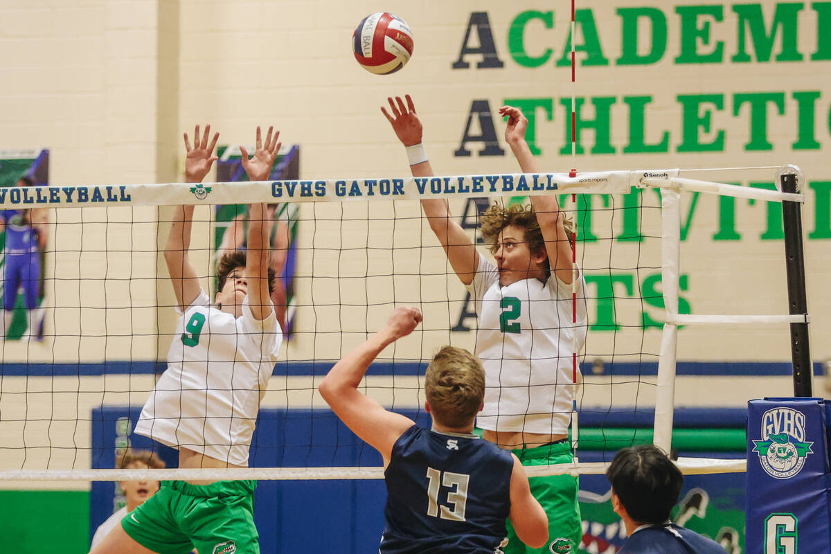 Green Valley teammates Brock Barney (2) and Brady Barney (9) fail to lodge the ball back on Sha ...