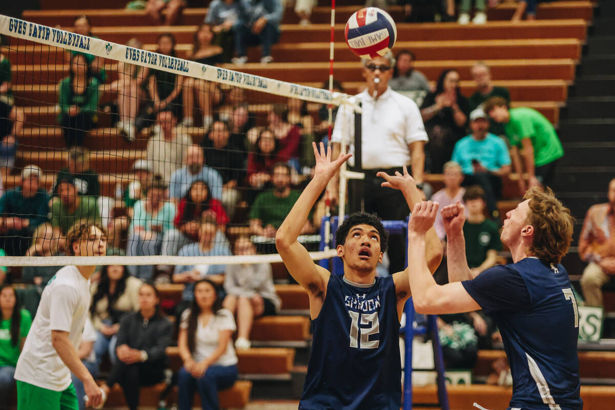 Shadow Ridge setter Kingston Jerome (12) looks up at the ball as he reaches to rally the ball d ...