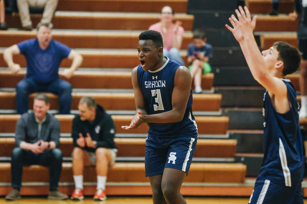 Shadow Ridge outside hitter Zion Moore (3) cheers as his team wins a set during a volleyball ma ...