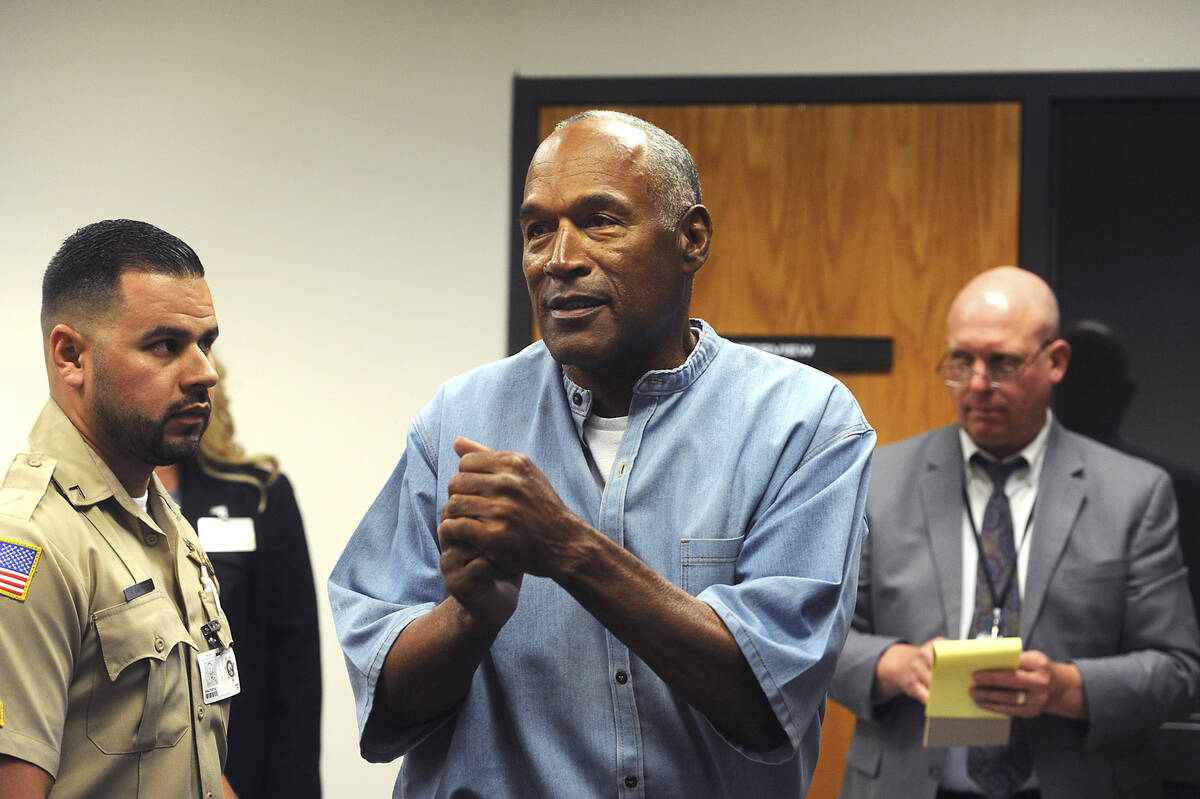 In this July 20, 2017 file photo, former NFL football star O.J. Simpson reacts after learning h ...
