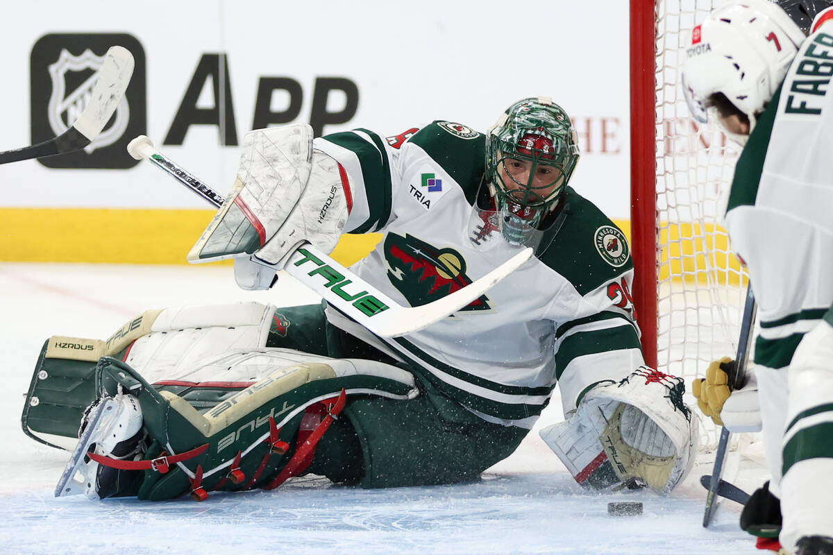 Wild goaltender Marc-Andre Fleury (29) eyes the puck before the Golden Knights scored a goal du ...