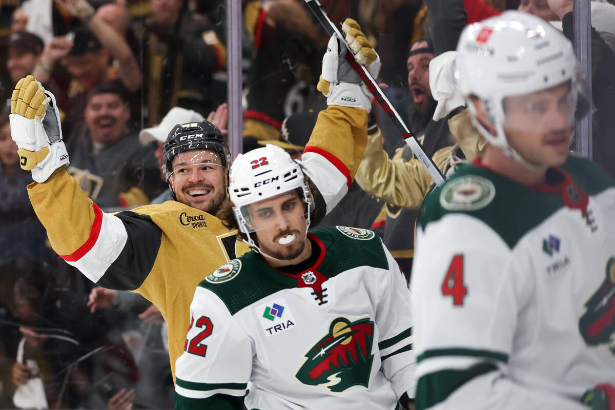 Golden Knights center Tomas Hertl, left, celebrates his first-ever goal as a Knight while the W ...