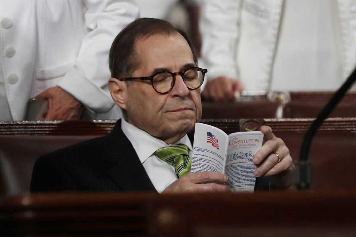 Rep. Jerrold Nadler, D-N.Y., reads a pocket copy of the U.S. Constitution as he waits for the a ...