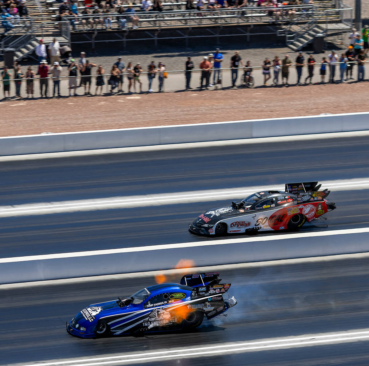 Funny Car drivers Terry Haddock, bottom, and Jeff Diehl race down the track during Day 2 of NHR ...