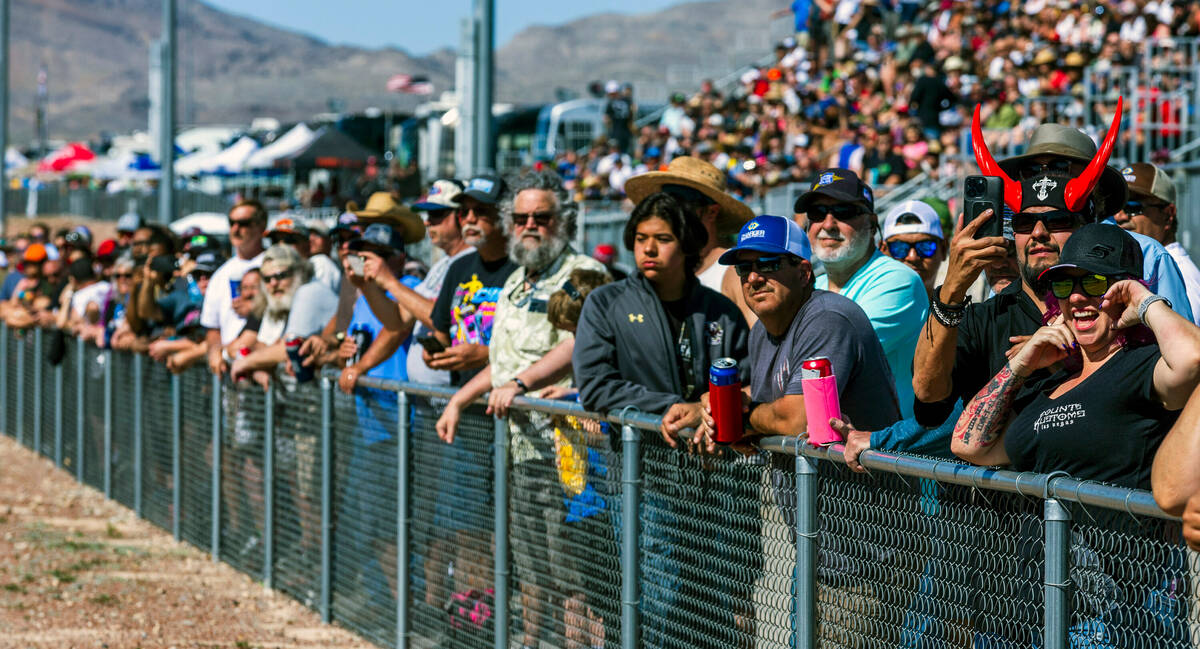 Fans enjoy some Top Fuel racing alongside the track during Day 2 of NHRA 4-Wide Nationals on &q ...