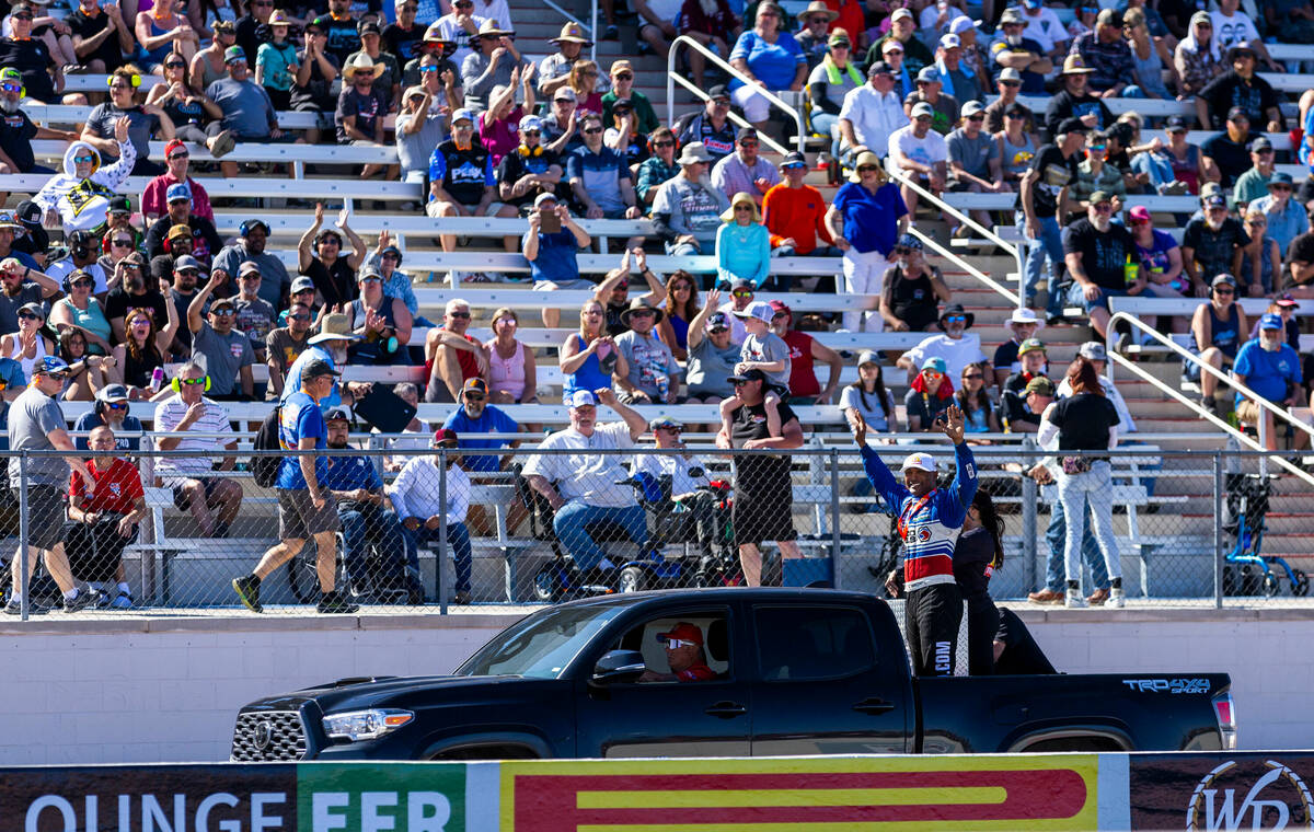 Top Fuel driver Antron Brown waves to the fans after a great race during Day 2 of NHRA 4-Wide N ...