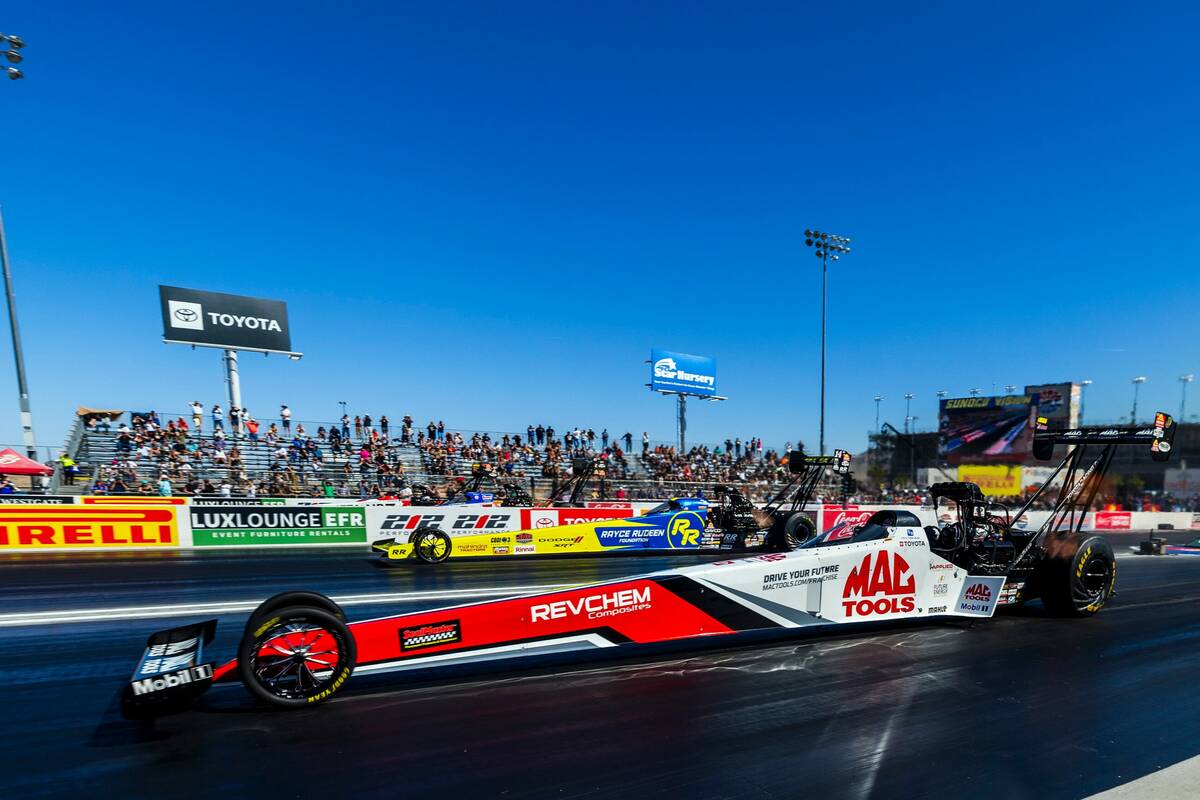 Top Fuel driver Doug Kalitta, front, leads Tony Stewart early in their race during Day 2 of NHR ...