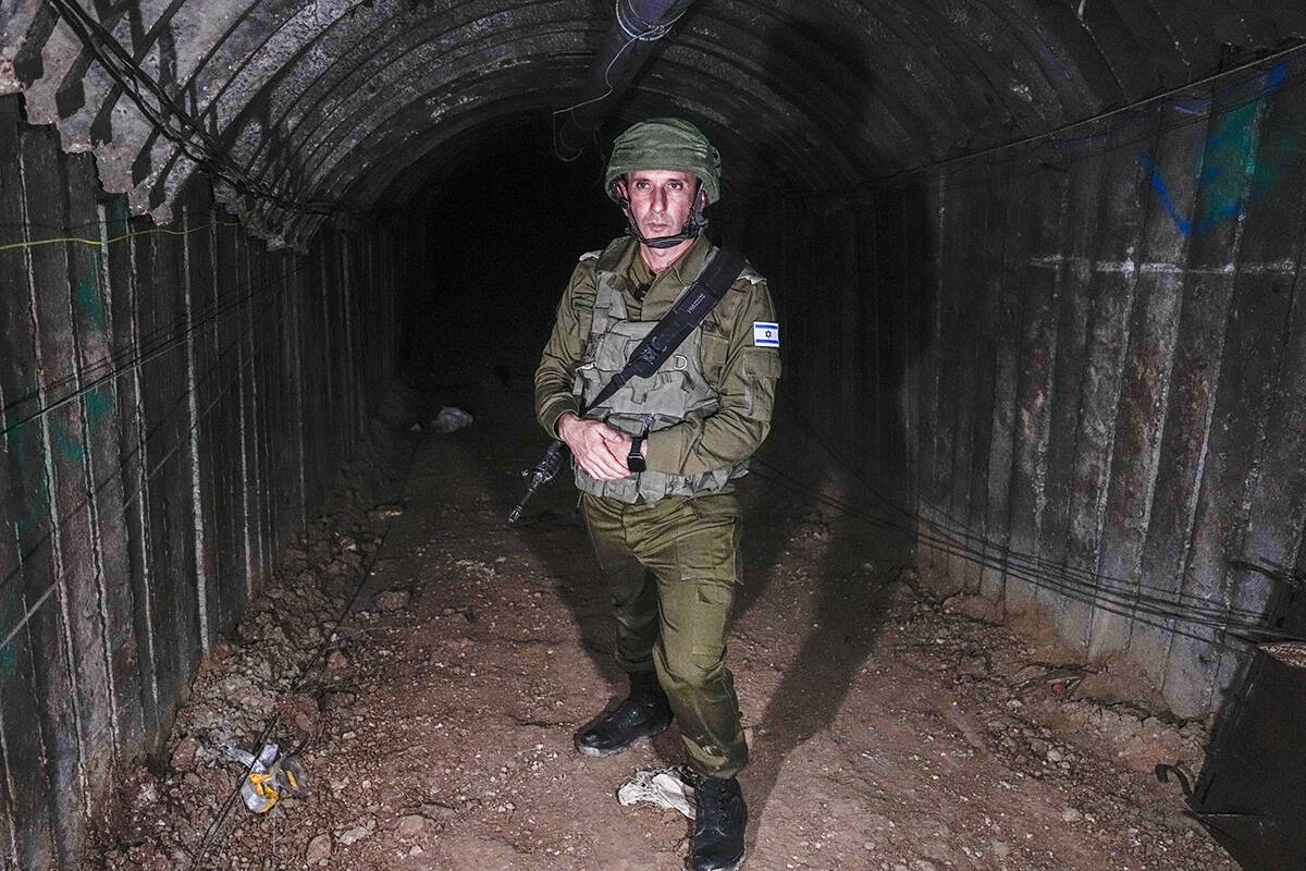 Israeli military spokesperson, Rear Adm. Daniel Hagari, speaks to the media in a tunnel that th ...