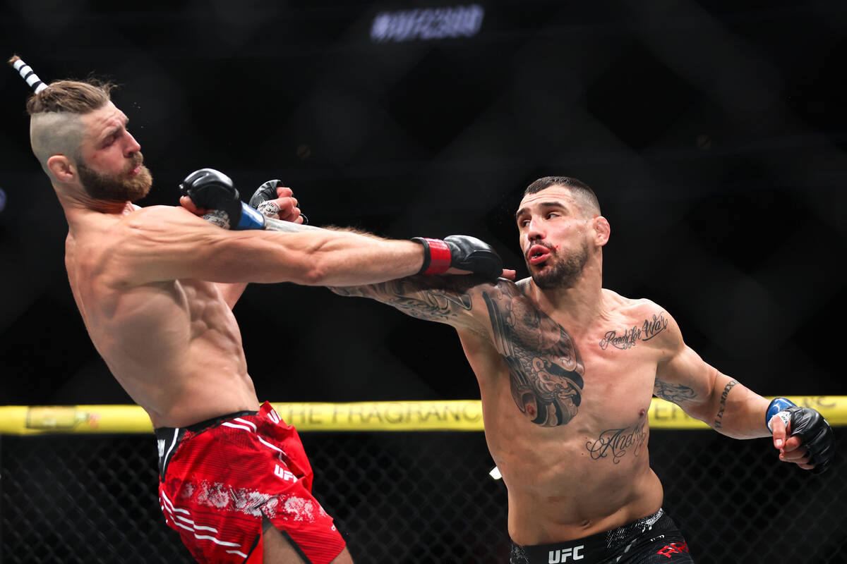 Jiri Prochazka ducks a punch from Aleksandar Rakic during a UFC 300 mixed martial arts light he ...