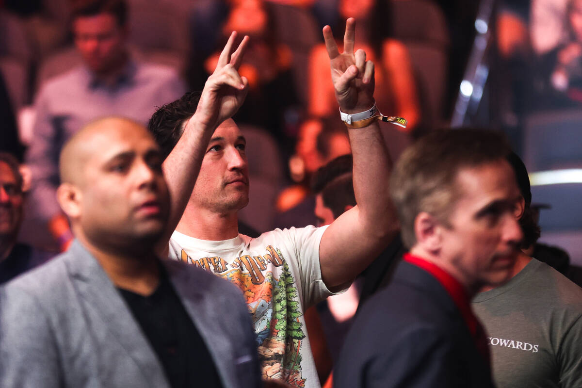 Actor Miles Teller shows peace signs while attending UFC 300 at T-Mobile Arena Saturday, April ...