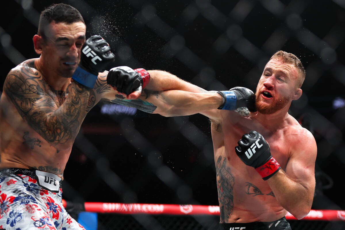 Justin Gaethje gets a right on Max Holloway during a UFC 300 mixed martial arts lightweight bou ...