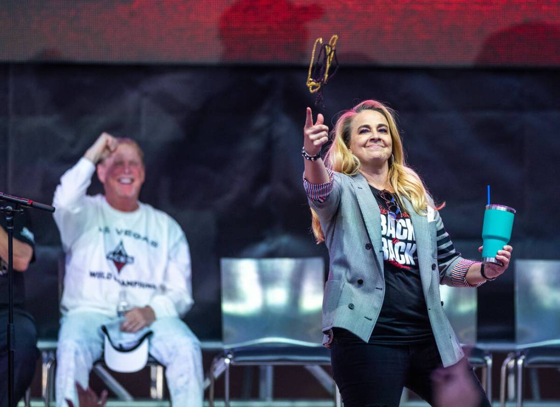 Aces Head Coach Becky Hammon tosses beads to the crowd during their championship celebration at ...