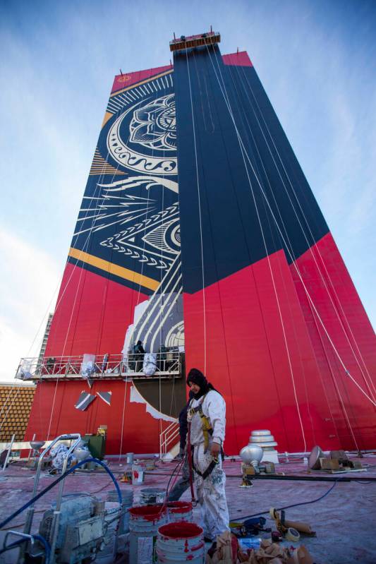 A mural by contemporary street artist Shepard Fairey is shown in progress on the side of The Pl ...