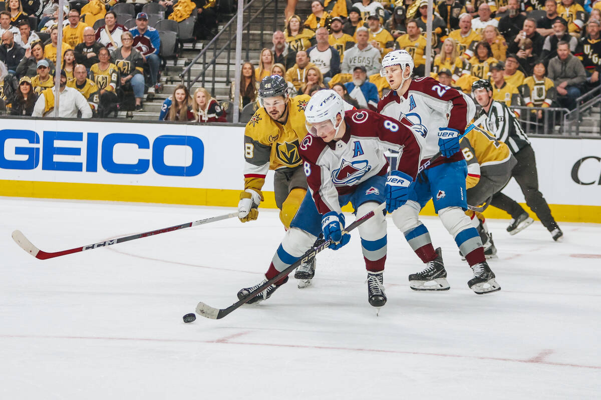 Golden Knights center Tomas Hertl (48) and Colorado Avalanche defenseman Cale Makar (8) skate a ...