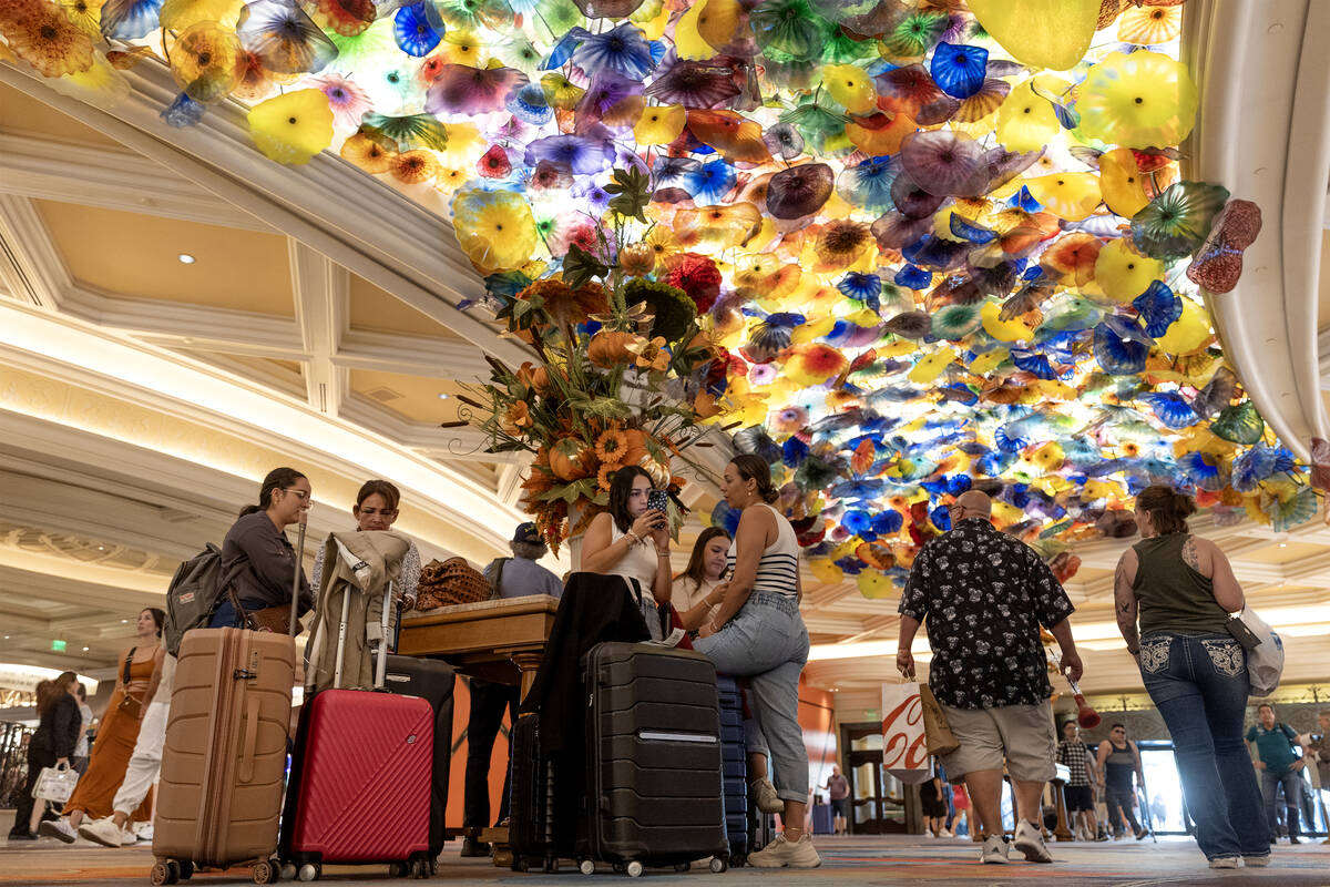 Guests wait in the lobby at Bellagio on Friday, Sept. 15, 2023, in Las Vegas. (Ellen Schmidt/La ...