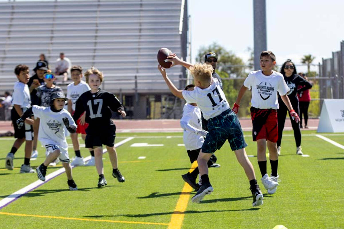 A participant of Davante Adams’ youth camp makes a catch on Sunday, April 14, 2024, at S ...