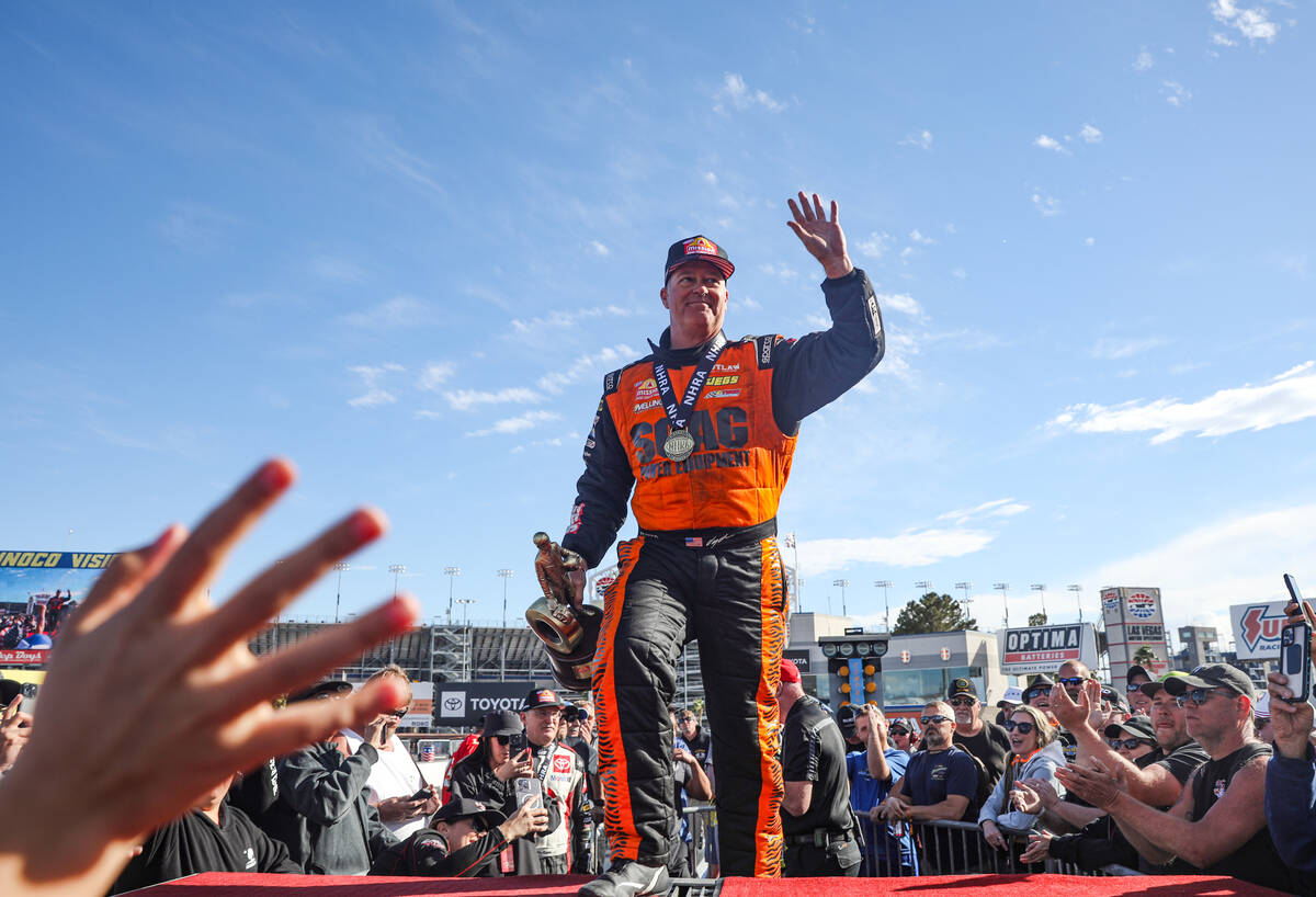 Pro stock driver Jeg Coughlin Jr. gestures to the crowd after winning the NHRA 4-Wide Nationals ...