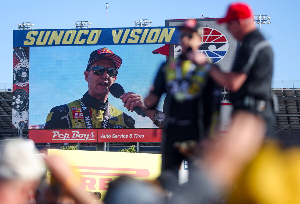 Funny car driver Bob Tasca addresses the audience after winning the NHRA 4-Wide Nationals at th ...