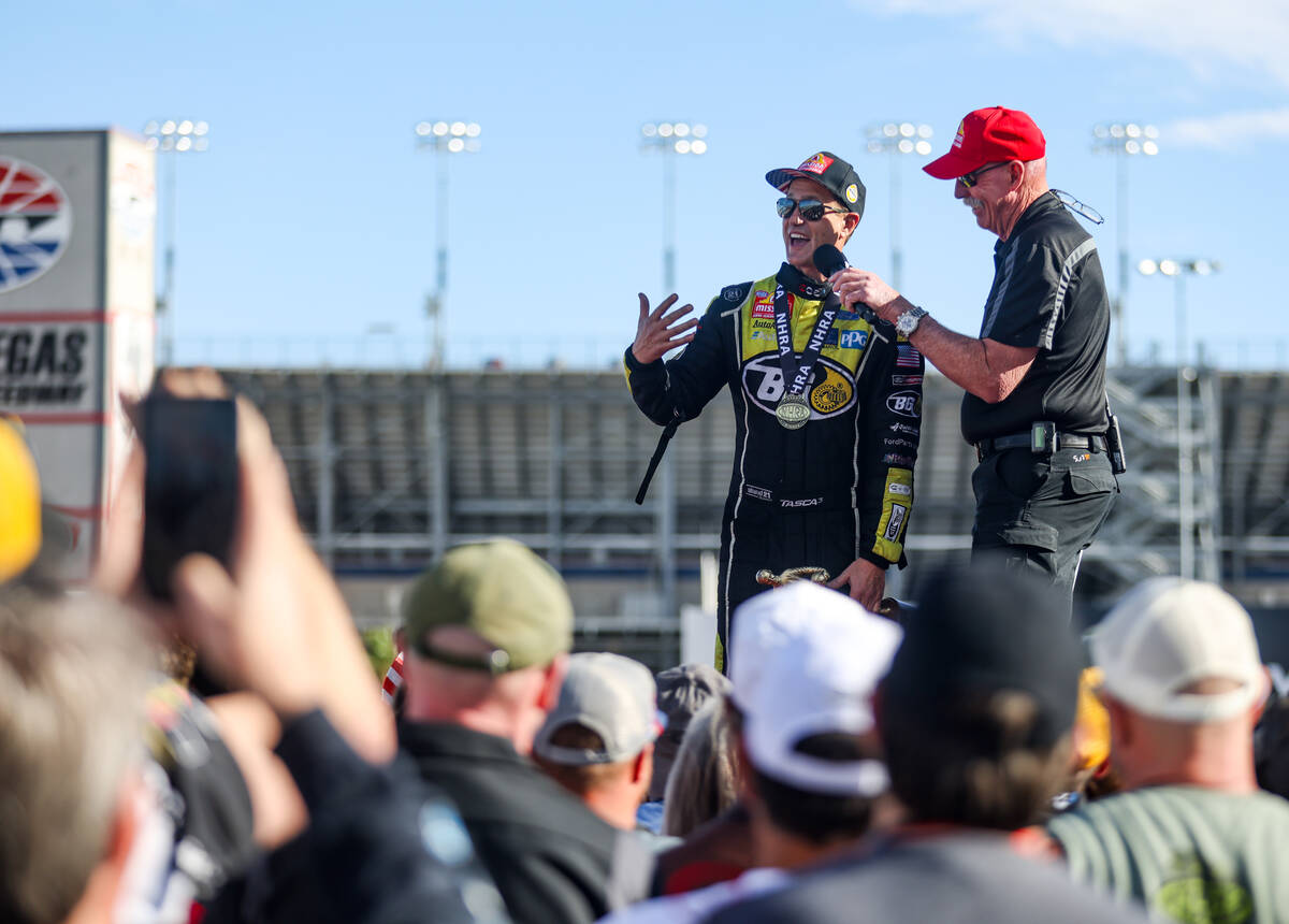 Funny car driver Bob Tasca is interviewed by Alan Reinhart after winning the NHRA 4-Wide Nation ...