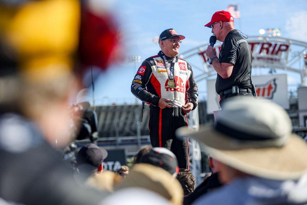 Top fuel driver Doug Kalitta is interviewed by Alan Reinhart after winning the NHRA 4-Wide Nat ...
