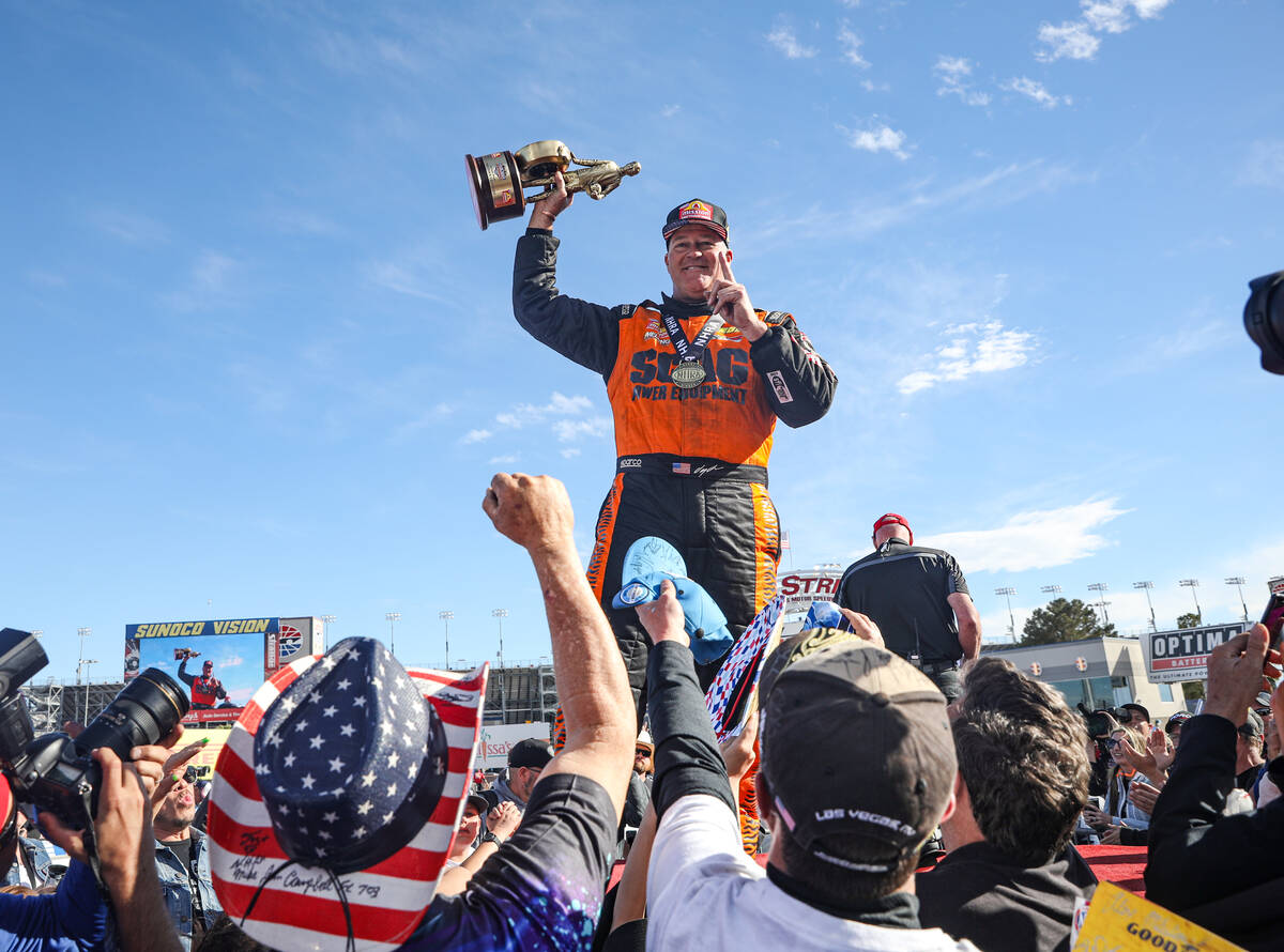 Pro stock driver Jeg Coughlin Jr. gestures to fans after winning the NHRA 4-Wide Nationals at t ...
