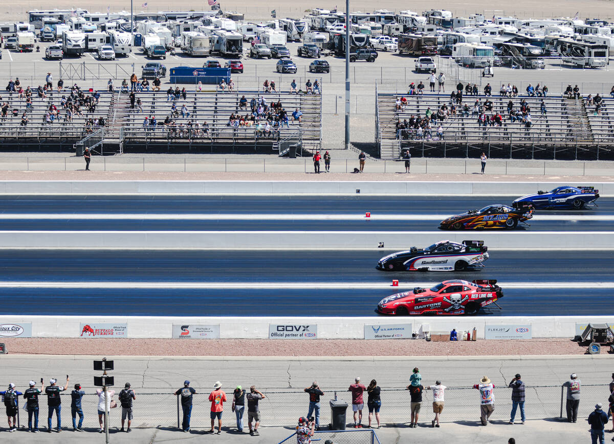 Funny car drivers race during day three of NHRA 4-Wide Nationals at the Las Vegas Motor Speedwa ...