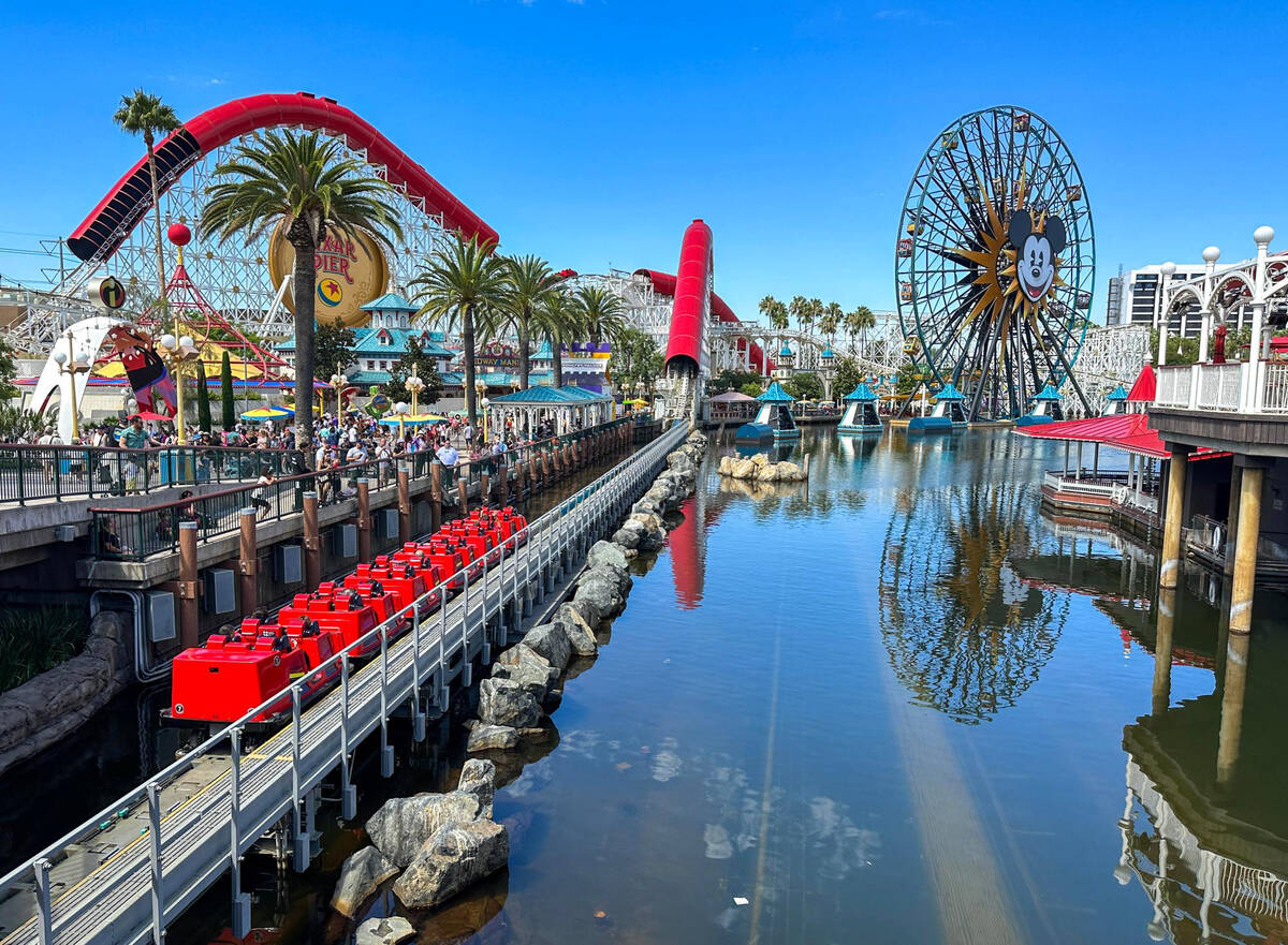 Incredicoaster zooms through Pixar Pier at California Adventure in Anaheim, California, on Aug. ...