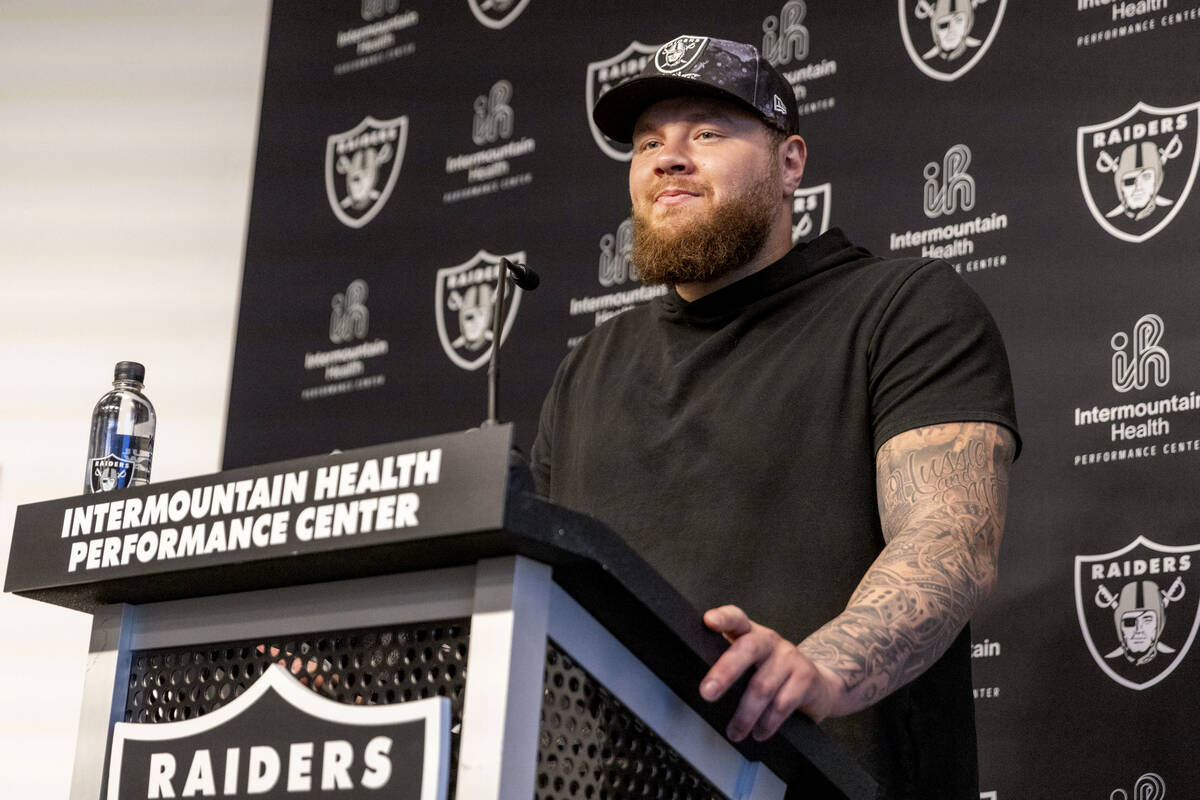 Raiders center Andre James takes questions during a media availability on the first day of thei ...