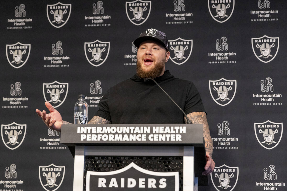 Raiders center Andre James answers questions during a media availability on the first day of th ...