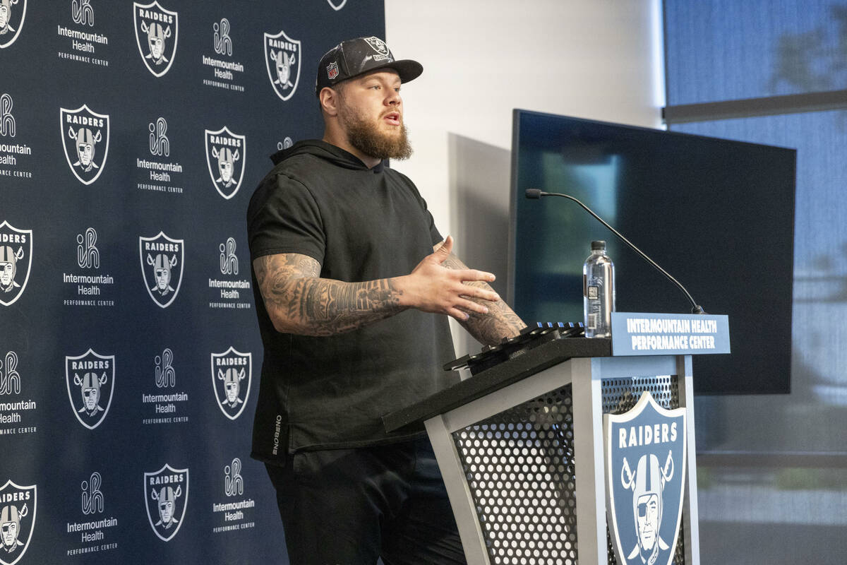 Raiders center Andre James answers questions during a media availability on the first day of th ...