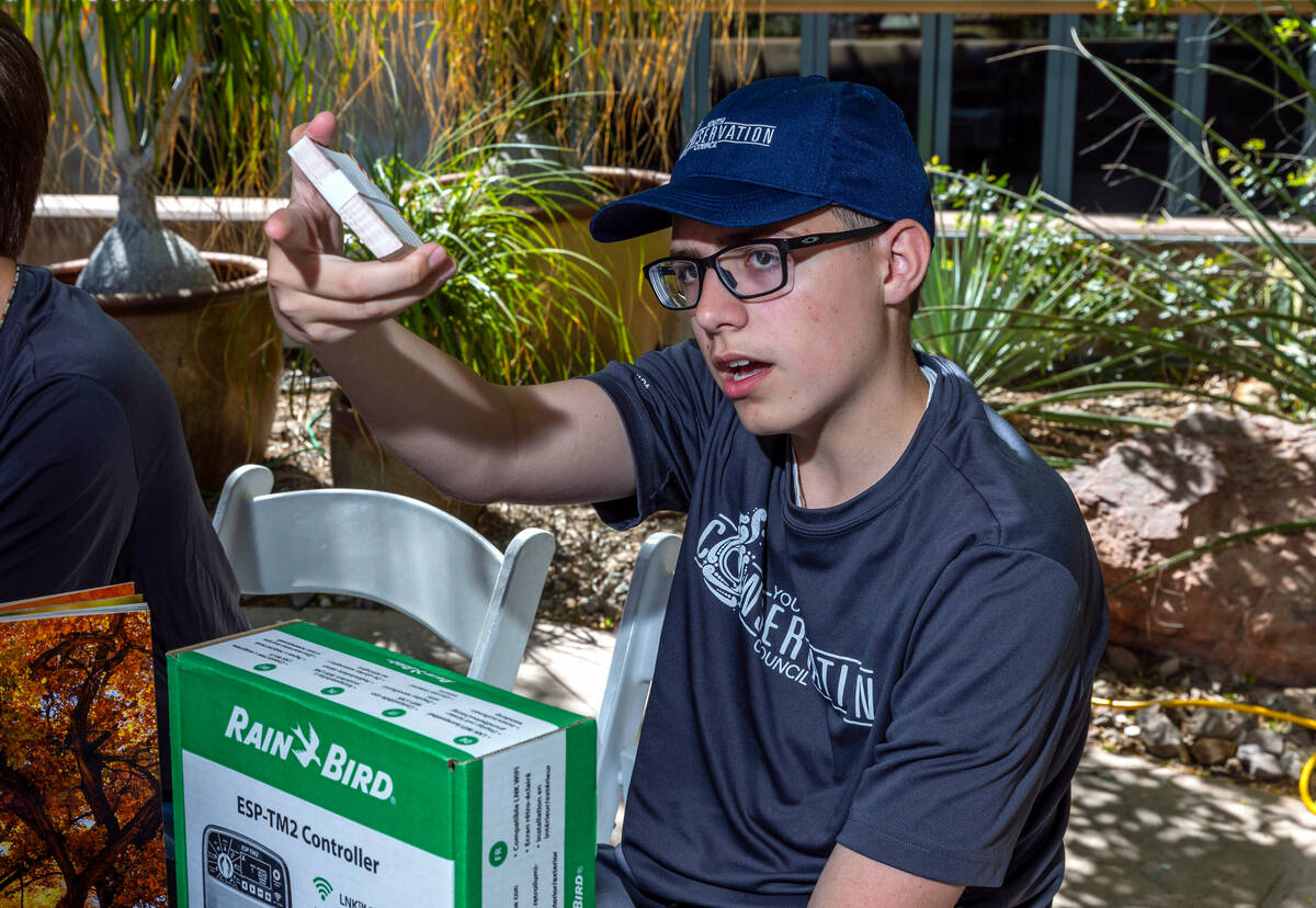 Fisher Parry with the Southern Nevada Water Authority's Youth Conservation Council collects raf ...