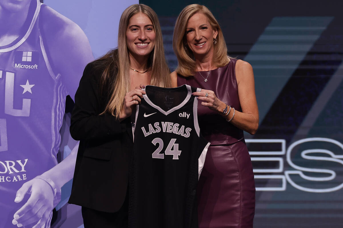 Iowa's Kate Martin, left, poses for a photo with WNBA commissioner Cathy Engelbert, right, afte ...