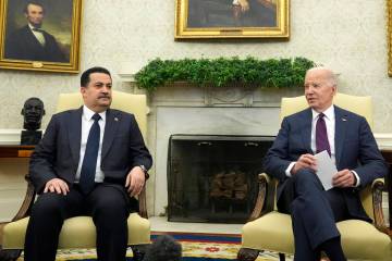 President Joe Biden, right, meets with Iraq's Prime Minister Shia al-Sudani in the Oval Office ...
