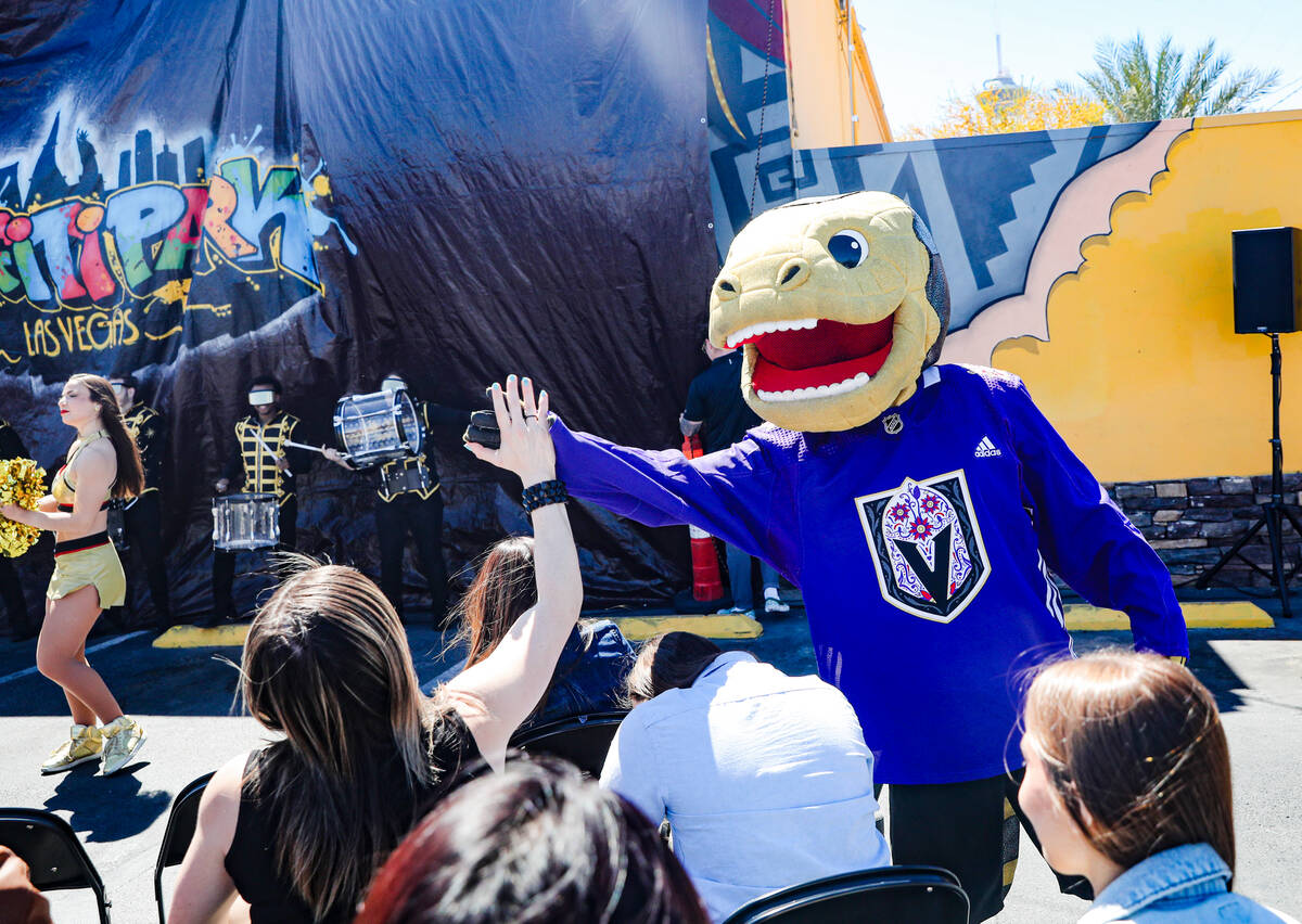 Golden Knights mascot Chance greets the crowd at an event unveiling a Golden Knights mural on t ...