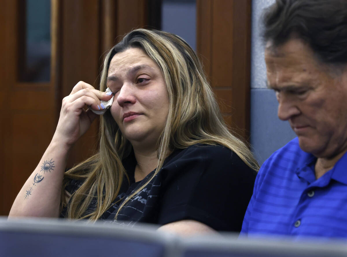Melissa Maxie-Mathis, the stepmother of drug overdose victim Jacob Mathis, weeps as she attends ...