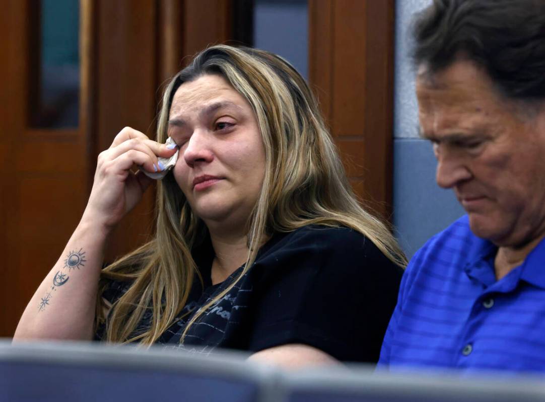 Melissa Maxie-Mathis, the stepmother of drug overdose victim Jacob Mathis, weeps as she attends ...