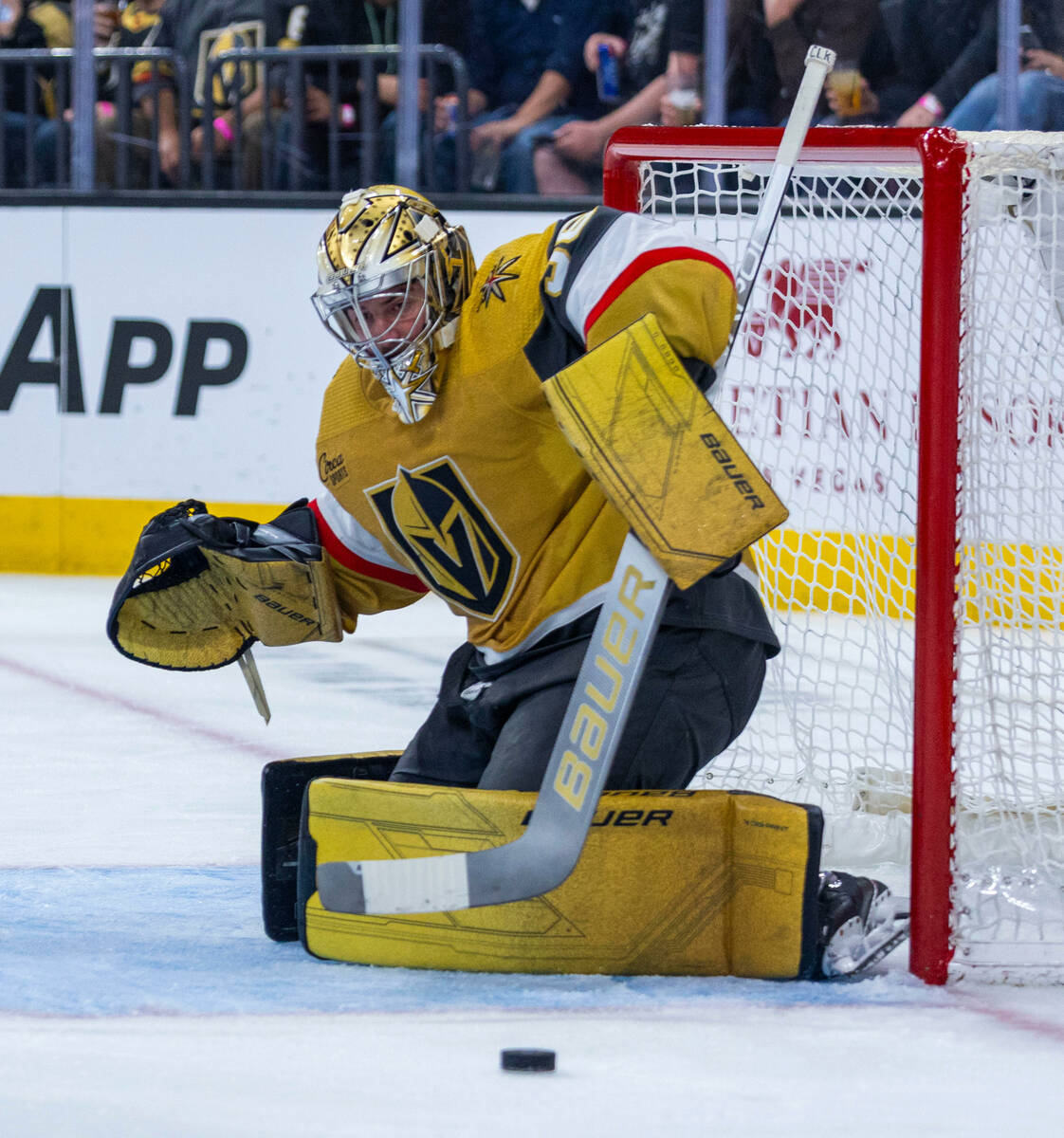 Golden Knights goaltender Logan Thompson (36) deflects a shot by the Chicago Blackhawks during ...