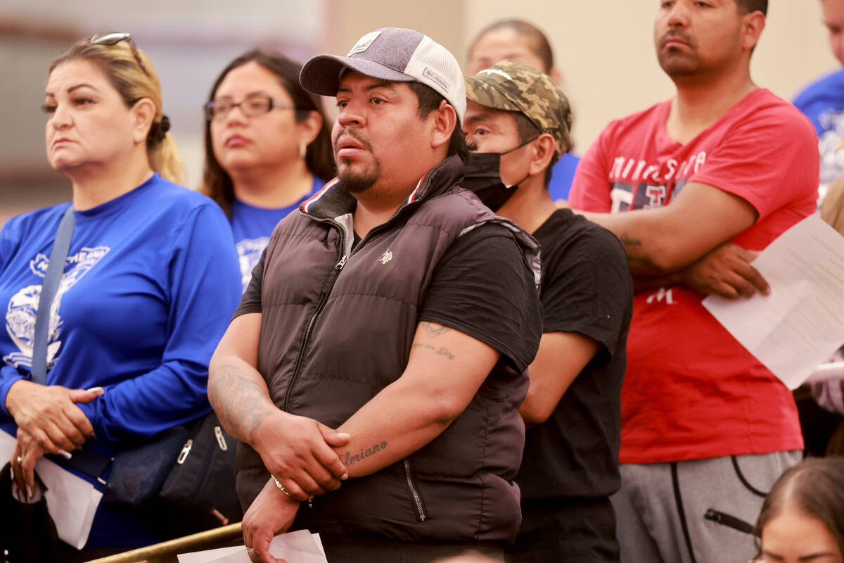 Audience members line up to speak during a public hearing on a sidewalk vendor licensing ordina ...