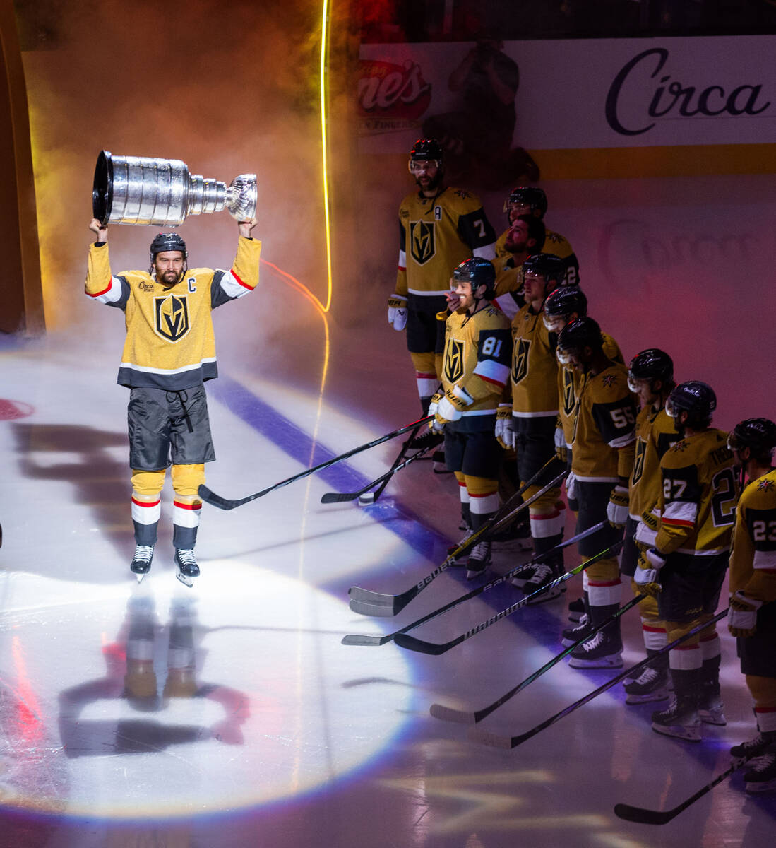 Golden Knights right wing Mark Stone (61) carries out the Stanley Cup during the raising of the ...