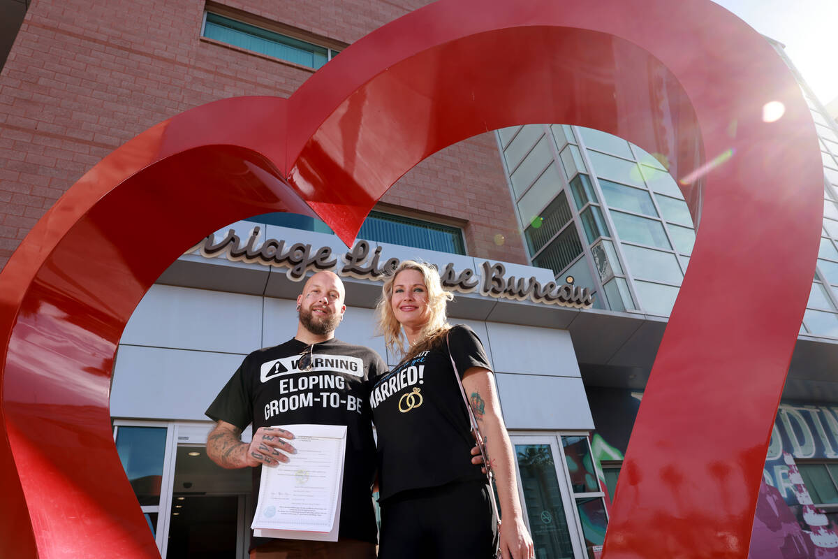 Adam Roberts and Mary Ellington of Franklinton N.C. pose with their license at the Marriage Lic ...