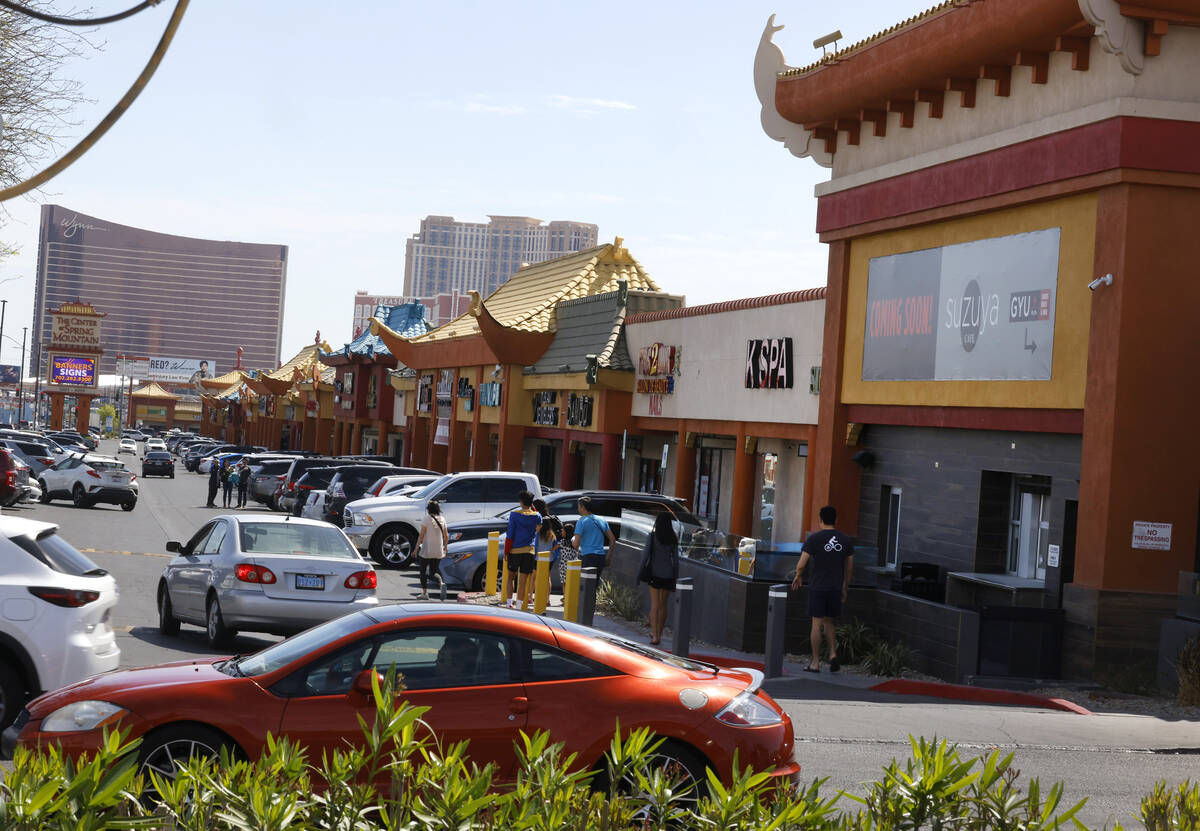 Visitors walk in Chinatown on Spring Mountain Road, on Friday, April 12, 2024, in Las Vegas. Cl ...