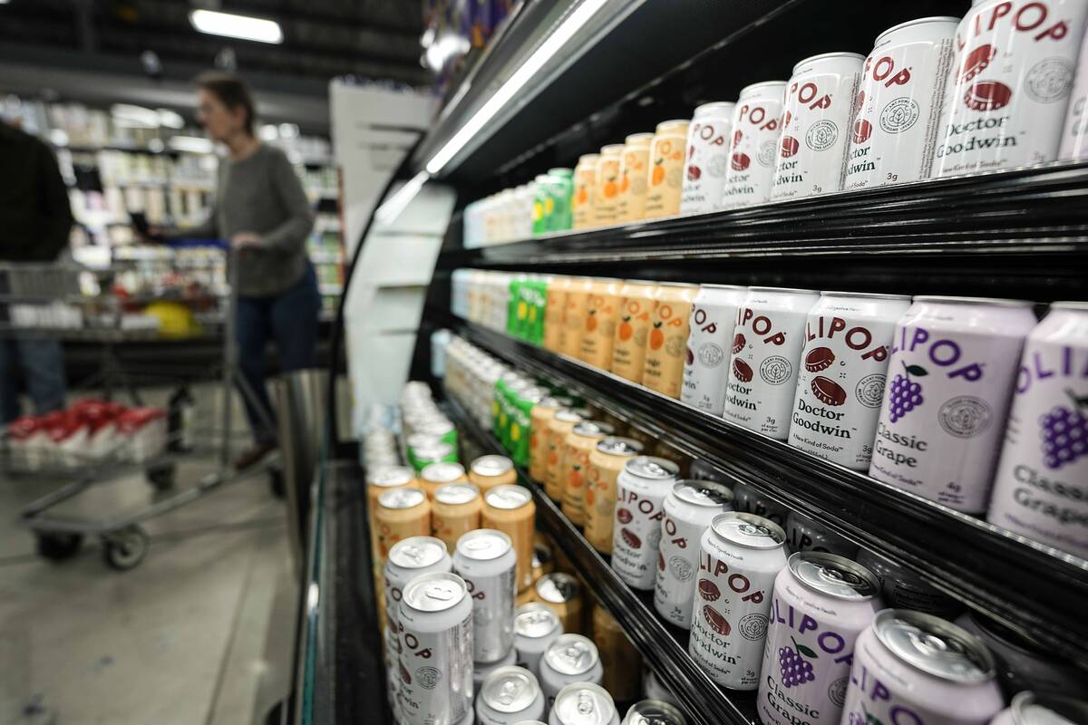 Cans of Olipop, a drink containing botanicals, plant fibers, and prebiotics, displayed at a Kro ...