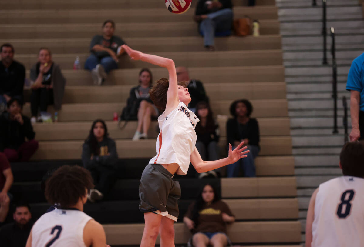 Legacy's Isaac Schultz (3) looks to spike the ball against Mojave during a boys high school vol ...