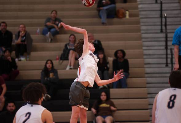 Legacy's Isaac Schultz (3) looks to spike the ball against Mojave during a boys high school vol ...